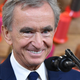 Bernard Arnault Smiling in front of a microphone